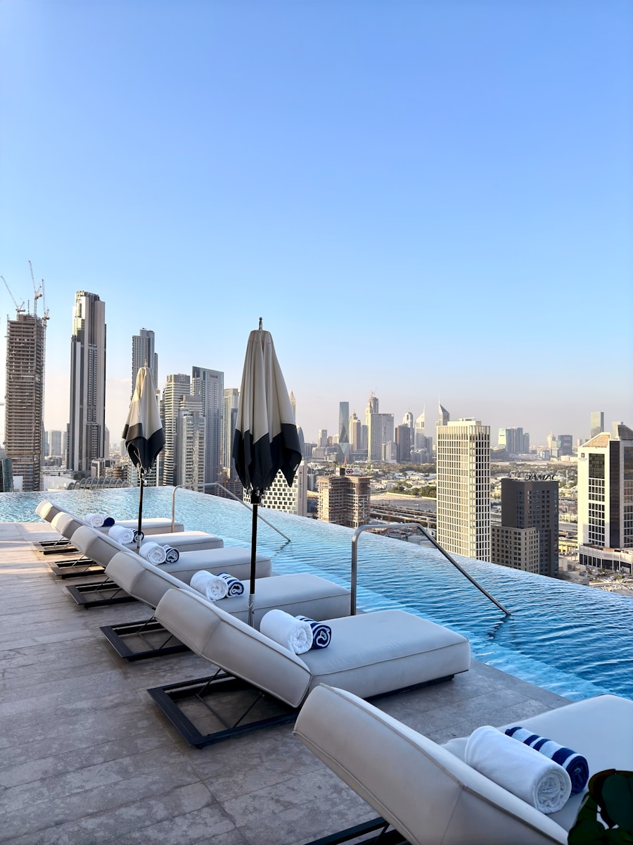 Relaxing pool overlooks a city skyline.